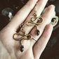 Brass and Amethyst Snake Dangle Earrings